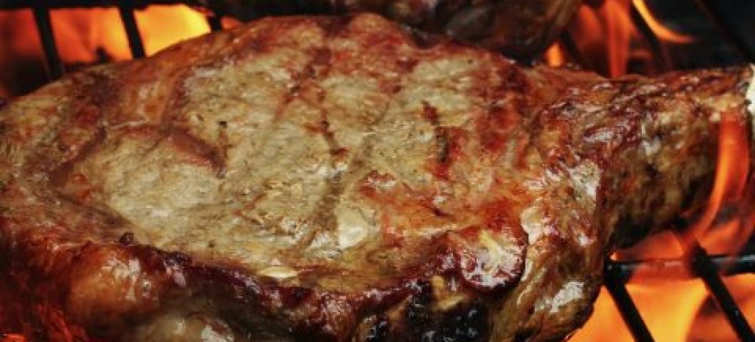 Photo of two grilled ribeye steaks