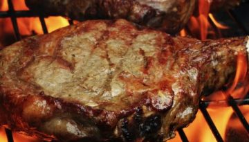 Photo of two grilled ribeye steaks