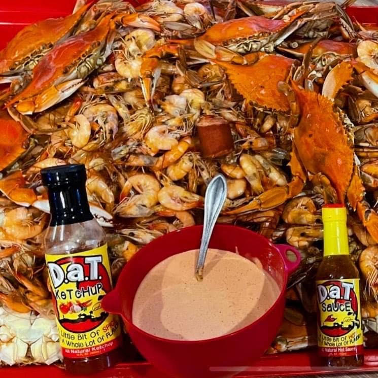 Photo of Cajun seafood boil with dip and dat sauce and dat ketchup