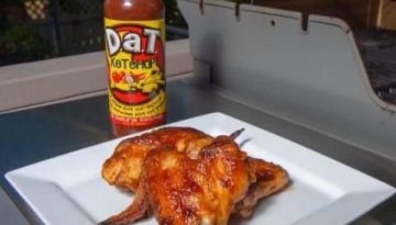 plate of Grilled Chicken Wings with a bottle of Dat Ketchup